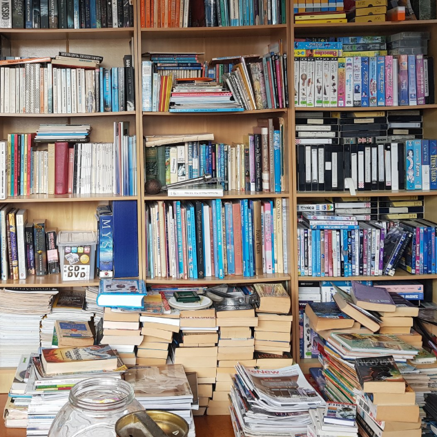 A photograph of piles of books